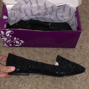 Black glitter loafers.